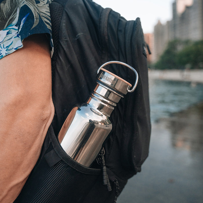 27oz-reflect-with-bamboo-cap-r9 K27SSLRF-MS-BAMBOO_reflect-bottle_backpack_lifestyle.jpg